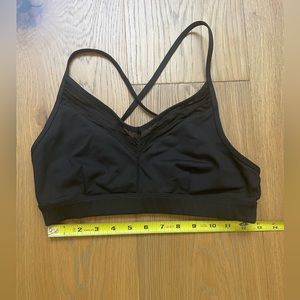Alo sports bra in black with added sexy sheer